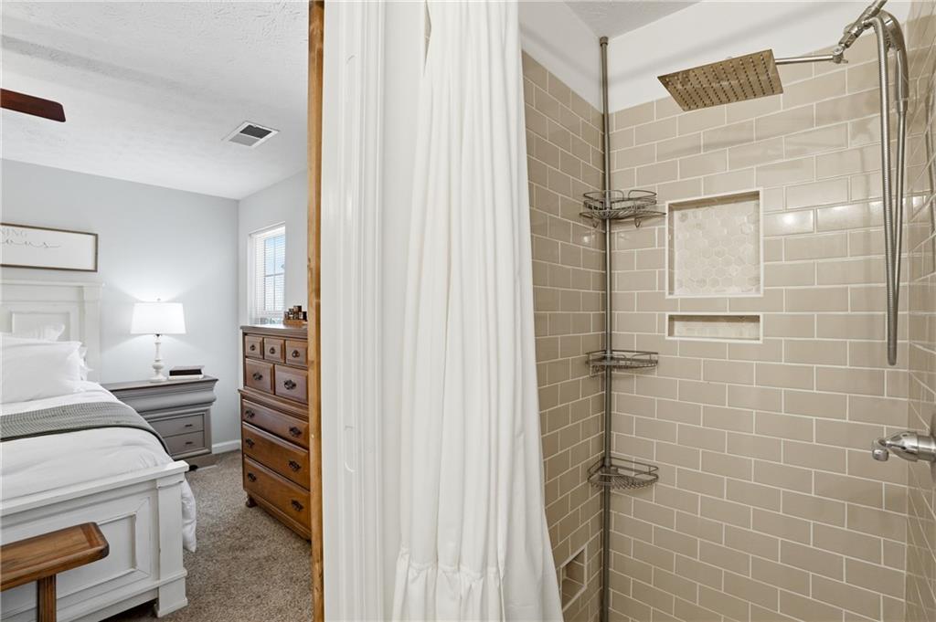 378 Baugh Street Commerce, GA 30529 - Photo 20 of 35 a room that has a bed and a bathroom in it