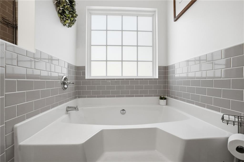 378 Baugh Street Commerce, GA 30529 - Photo 22 of 35 a white bath tub sitting next to a white sink