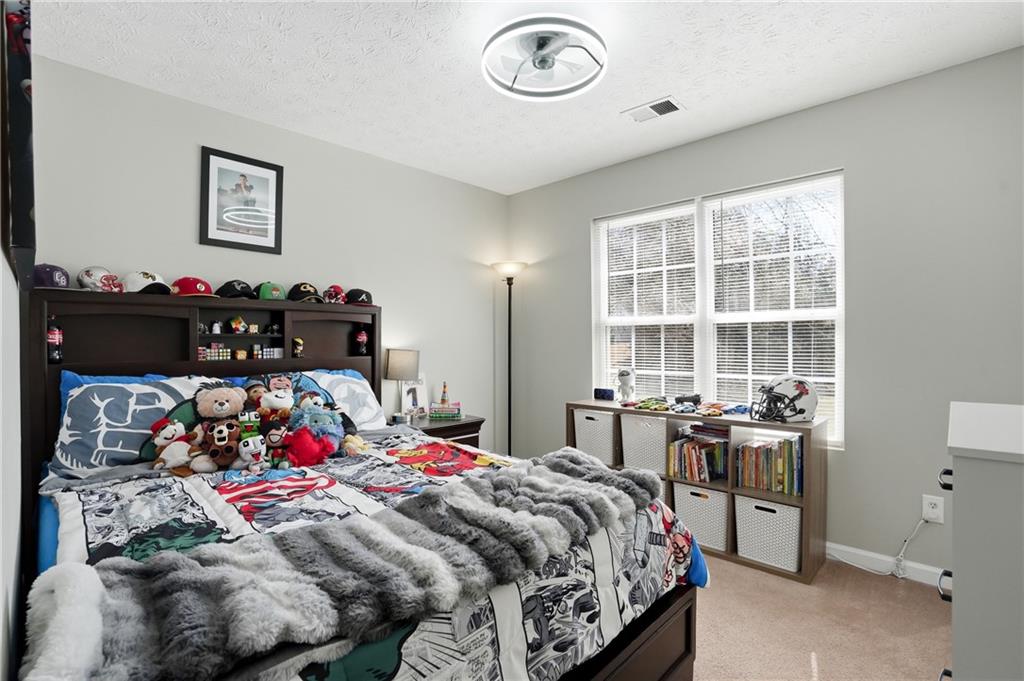 378 Baugh Street Commerce, GA 30529 - Photo 23 of 35 a bedroom with a bed and a window