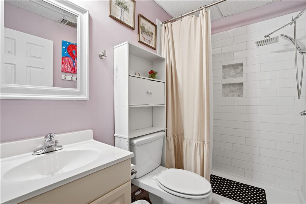378 Baugh Street Commerce, GA 30529 - Photo 27 of 35 a bathroom with a sink toilet and shower