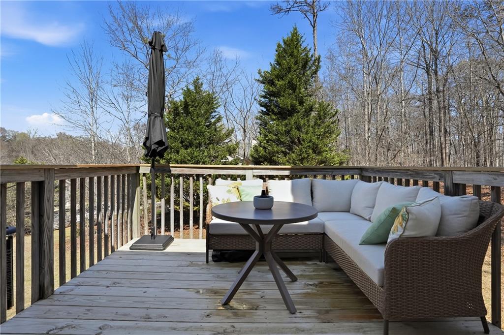 378 Baugh Street Commerce, GA 30529 - Photo 31 of 35 a roof deck with couches and wooden floor