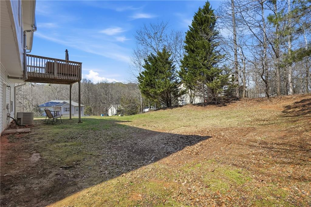 378 Baugh Street Commerce, GA 30529 - Photo 33 of 35 a view of a backyard with large trees