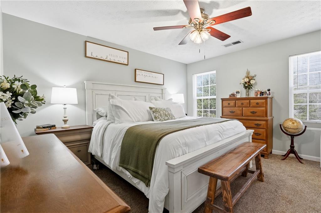 378 Baugh Street Commerce, GA 30529 - Photo 4 of 35 a bedroom with bed and window
