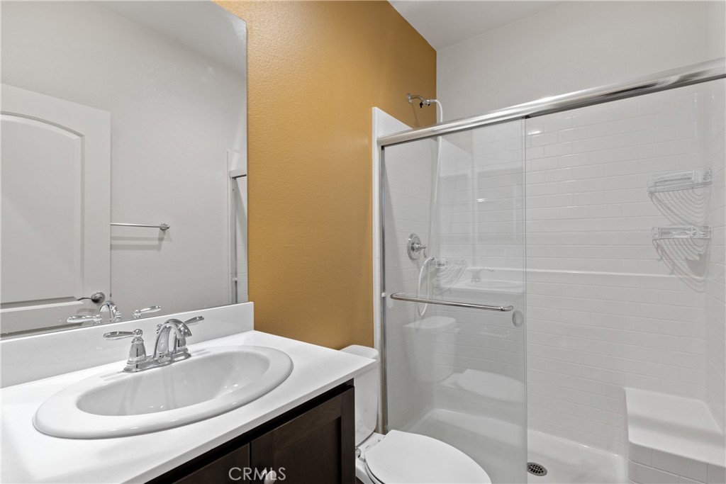 11738 Murray Way Beaumont, CA 92223 - Photo 16 of 45 a bathroom with a sink toilet and shower