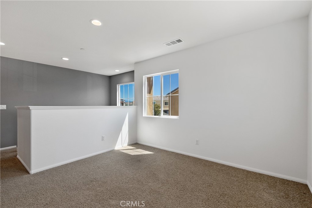 11738 Murray Way Beaumont, CA 92223 - Photo 19 of 45 a view of an empty room with a window