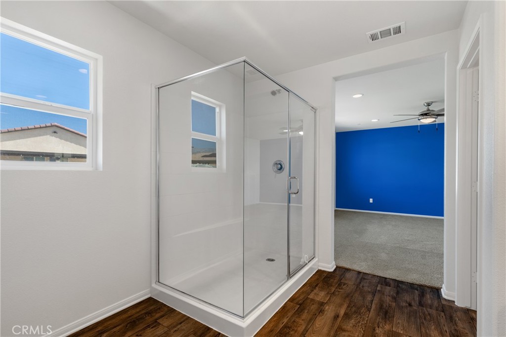11738 Murray Way Beaumont, CA 92223 - Photo 22 of 45 a view of a hallway with wooden floor and closet