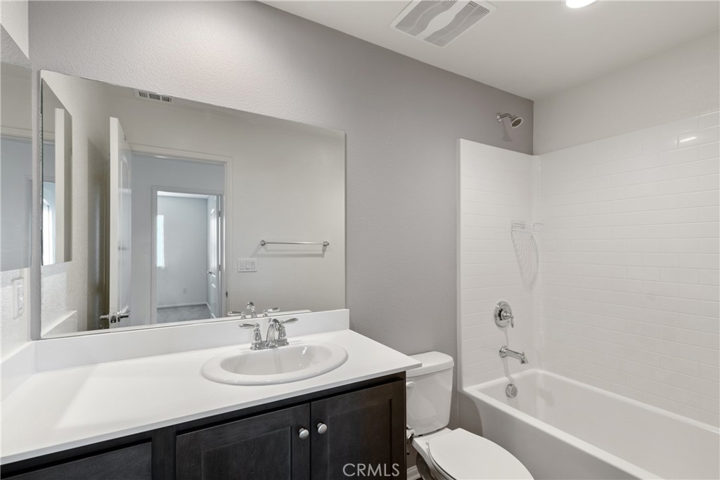 11738 Murray Way Beaumont, CA 92223 - Photo 29 of 45 a bathroom with a sink a toilet and shower