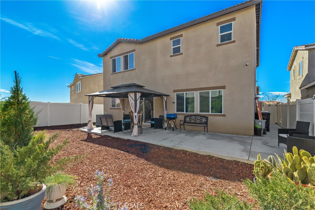 11738 Murray Way Beaumont, CA 92223 - Photo 30 of 45 a view of a house with backyard and sitting area
