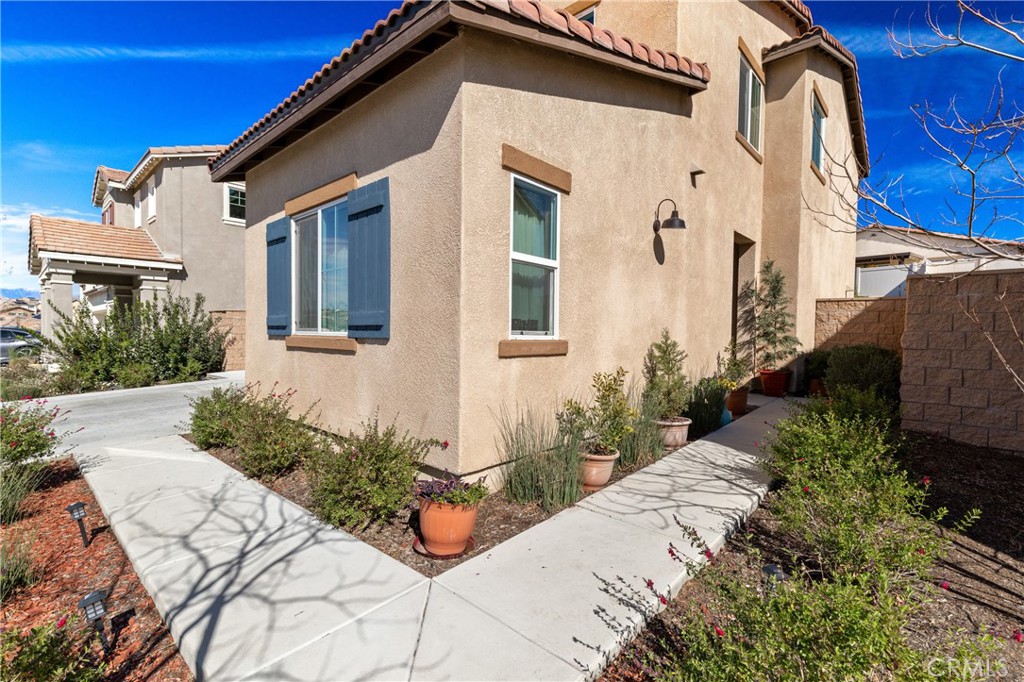 11738 Murray Way Beaumont, CA 92223 - Photo 3 of 45 a front view of a house with a yard