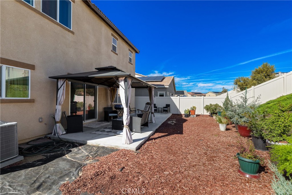 11738 Murray Way Beaumont, CA 92223 - Photo 33 of 45 a view of a house with a patio