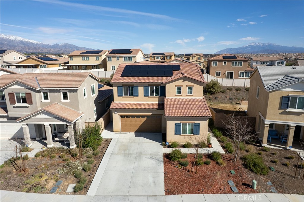 11738 Murray Way Beaumont, CA 92223 - Photo 34 of 45 a front view of a residential apartment building with a yard