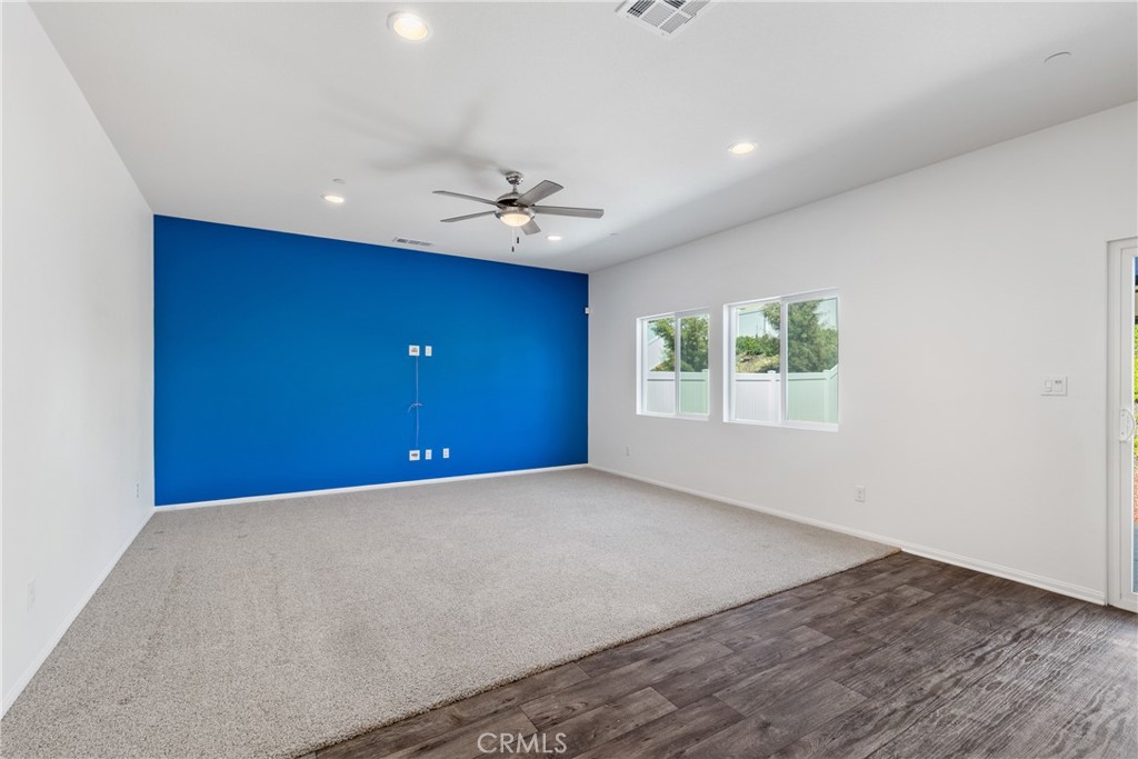 11738 Murray Way Beaumont, CA 92223 - Photo 9 of 45 wooden floor in an empty room with a window