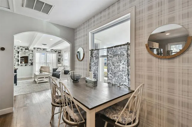 a kitchen with stainless steel appliances kitchen island granite countertop a refrigerator and a stove top oven