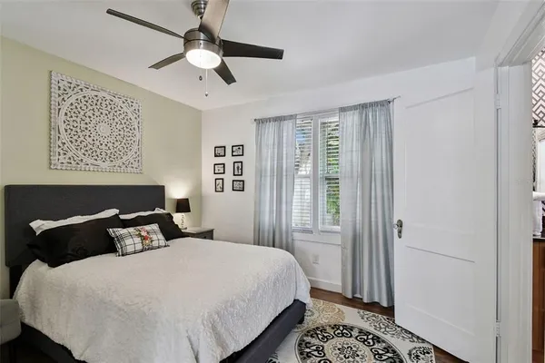 a bedroom with a bed and a window