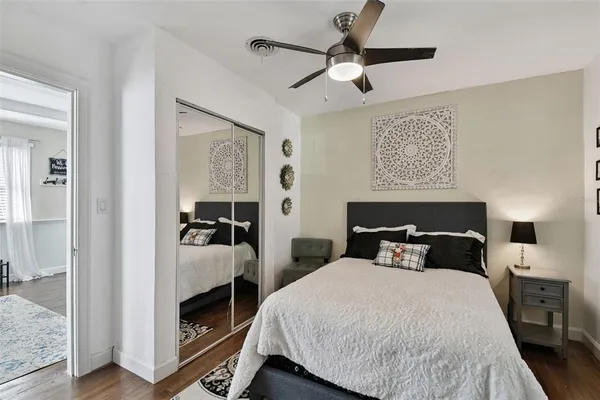 a bedroom with bed and window