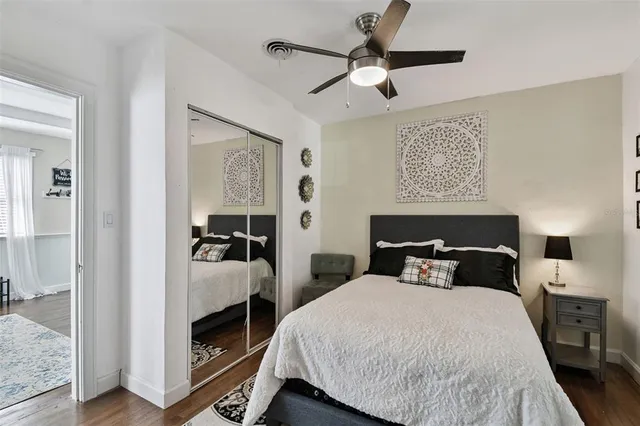 a bedroom with bed and window