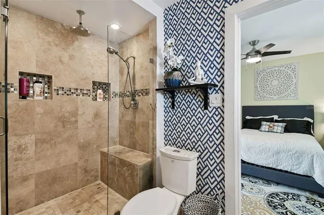 a bathroom with a sink toilet and shower