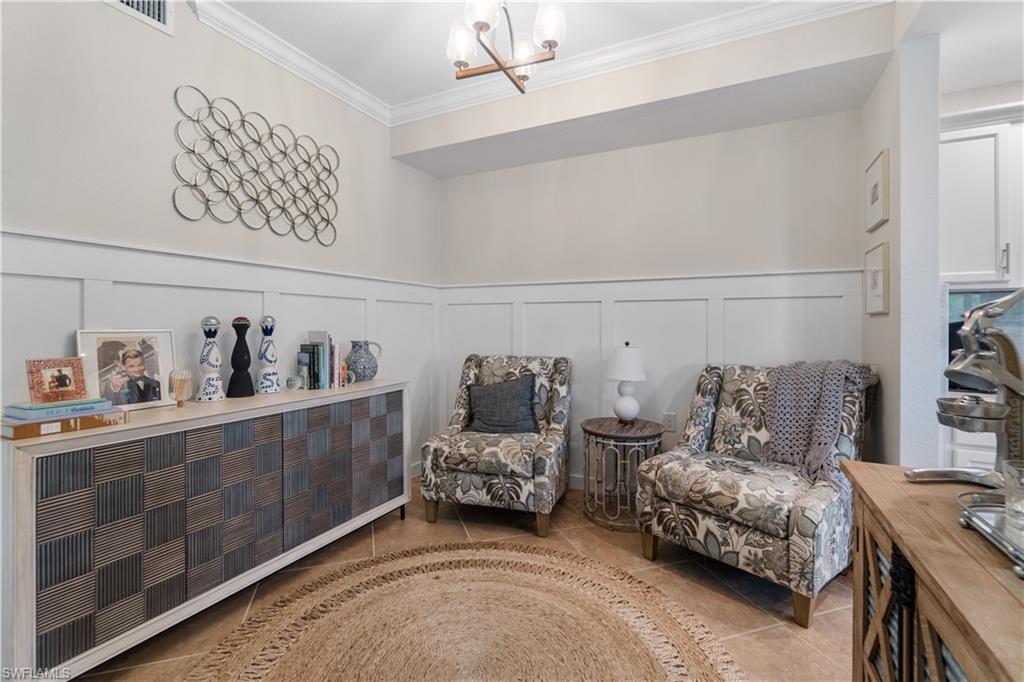 9834 Giaveno Circle, Unit 1726 Naples, FL 34113 - Photo 11 of 20 a bedroom with furniture and a window