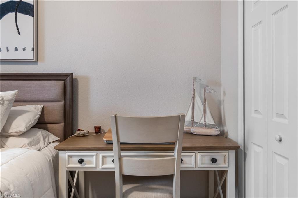 9834 Giaveno Circle, Unit 1726 Naples, FL 34113 - Photo 16 of 20 a stove top oven sitting inside of a kitchen
