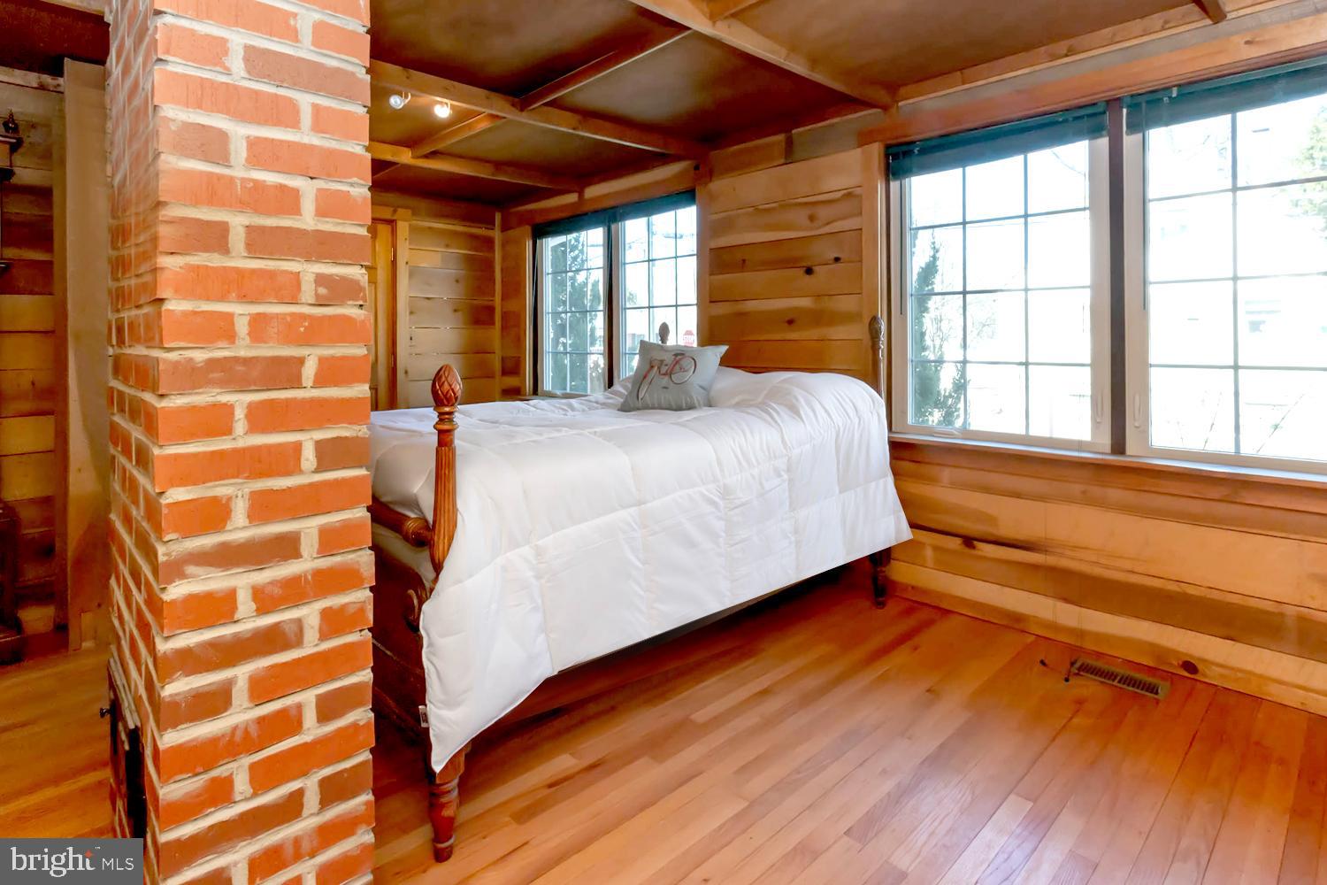 237 Carvel Road Pasadena, MD 21122 - Photo 15 of 44 Gleaming Natural Wood and Exposed Brick