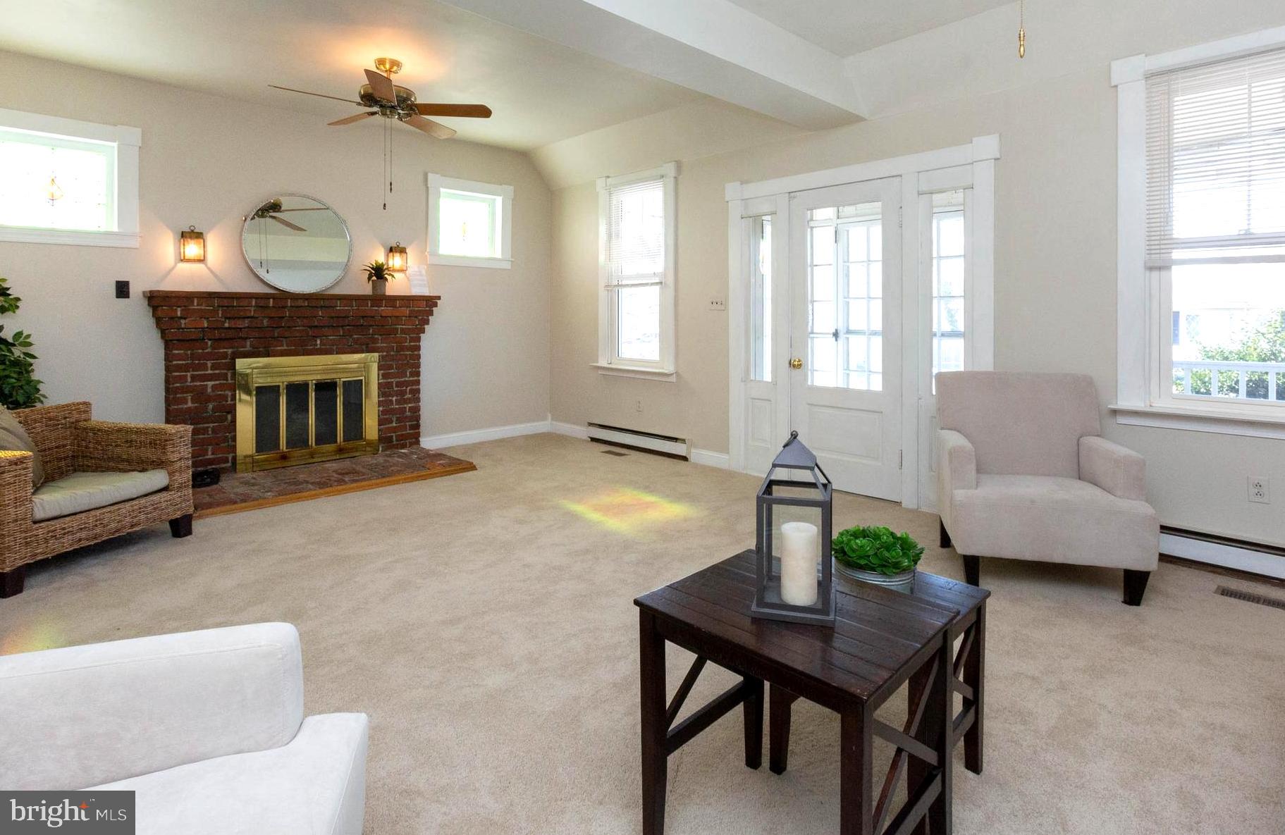 237 Carvel Road Pasadena, MD 21122 - Photo 9 of 44 10' Ceilings . Brick Wood Burning Fireplace