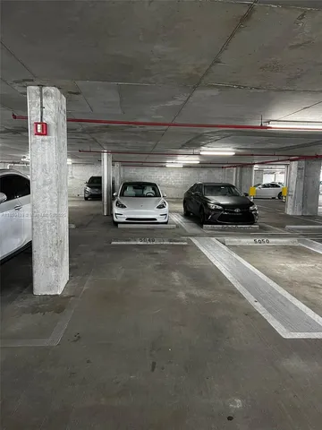 a view of building with potted plants