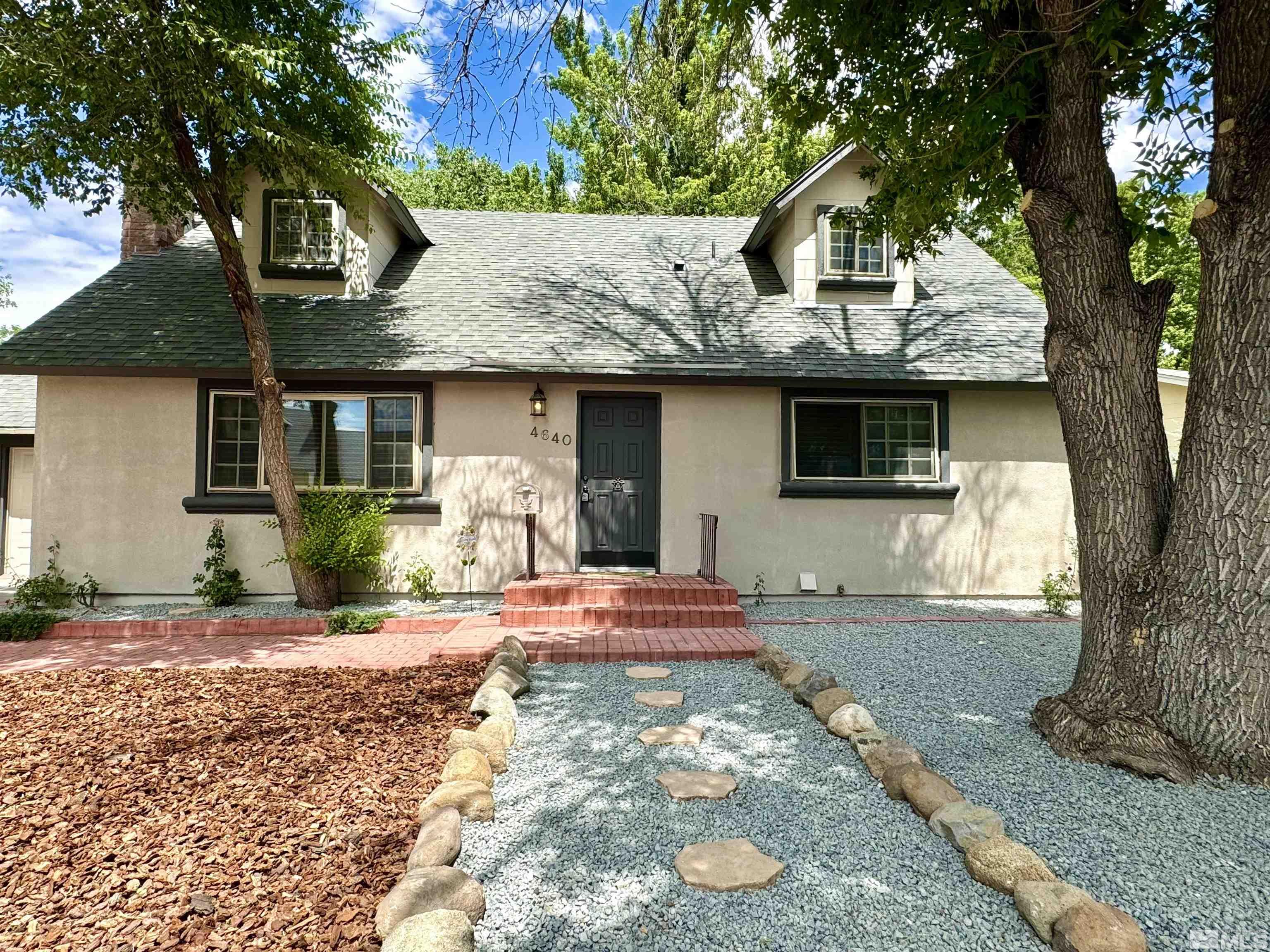 4640 Aster Drive Reno, NV 89502 - Photo 1 of 22 a front view of a house with garden