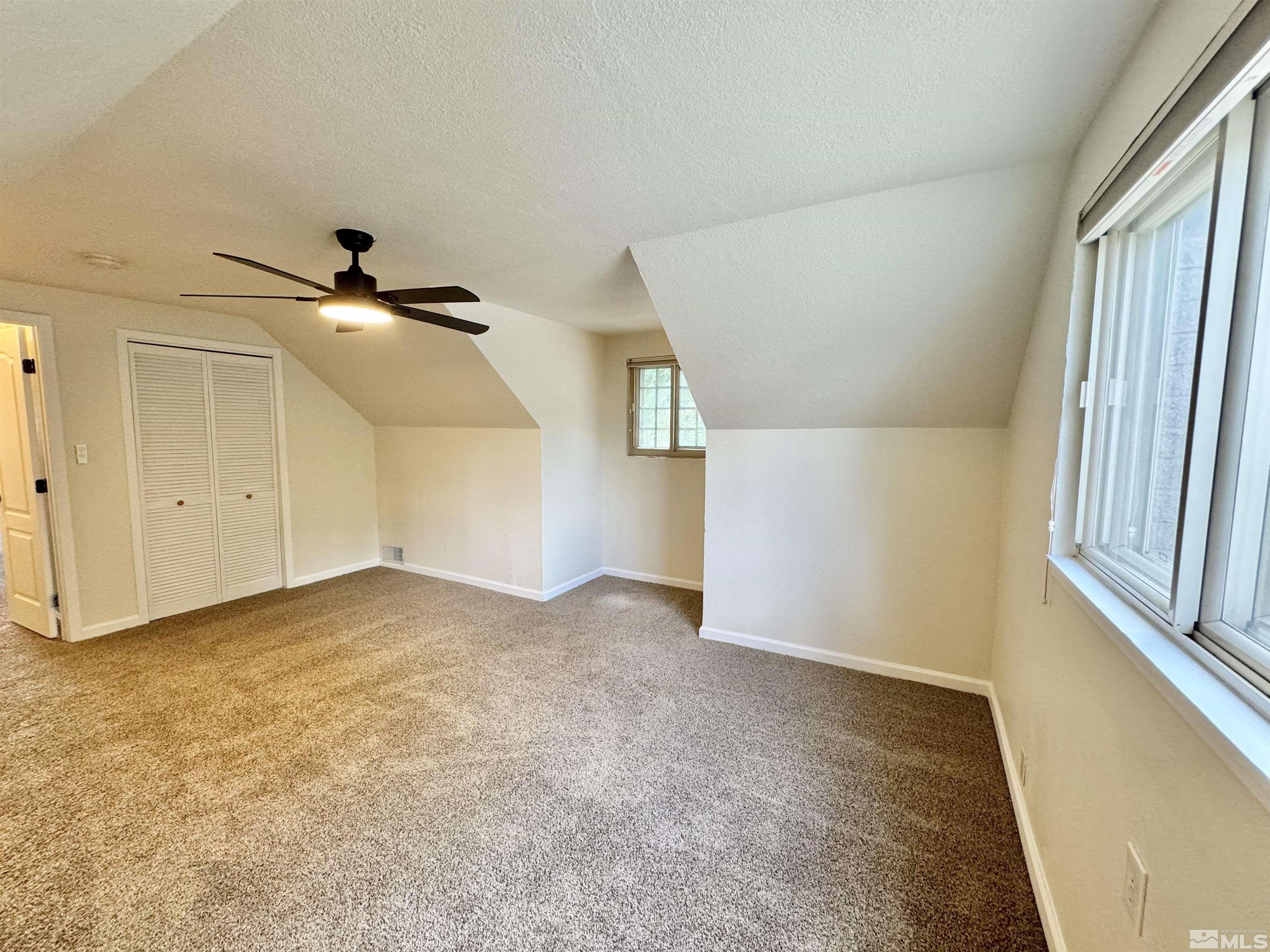 4640 Aster Drive Reno, NV 89502 - Photo 12 of 22 an empty room with windows and closet