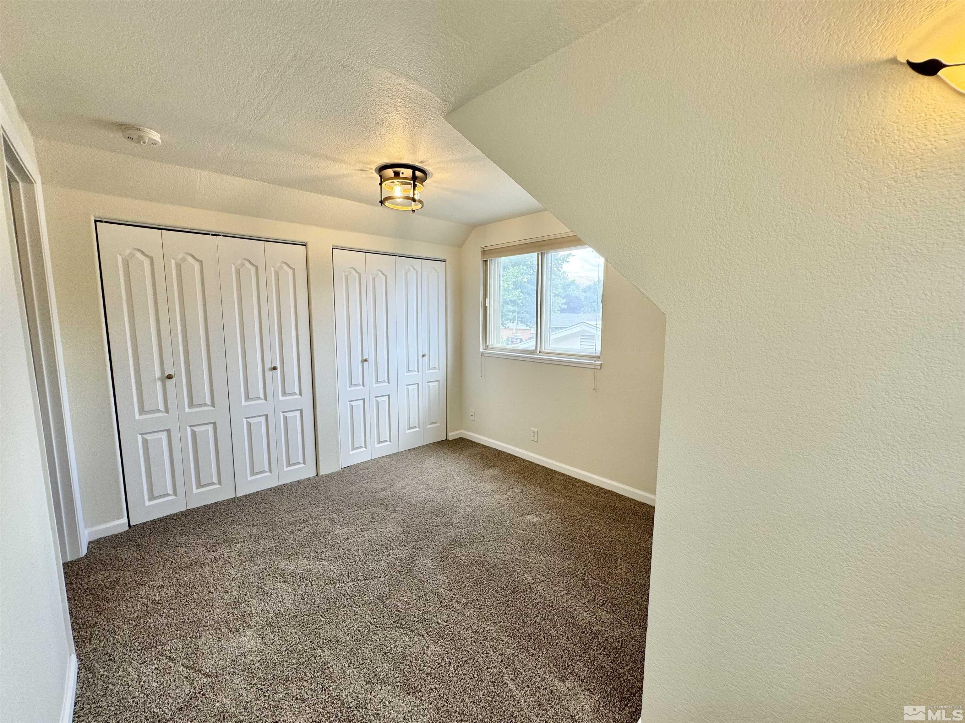 4640 Aster Drive Reno, NV 89502 - Photo 16 of 22 an empty room with windows