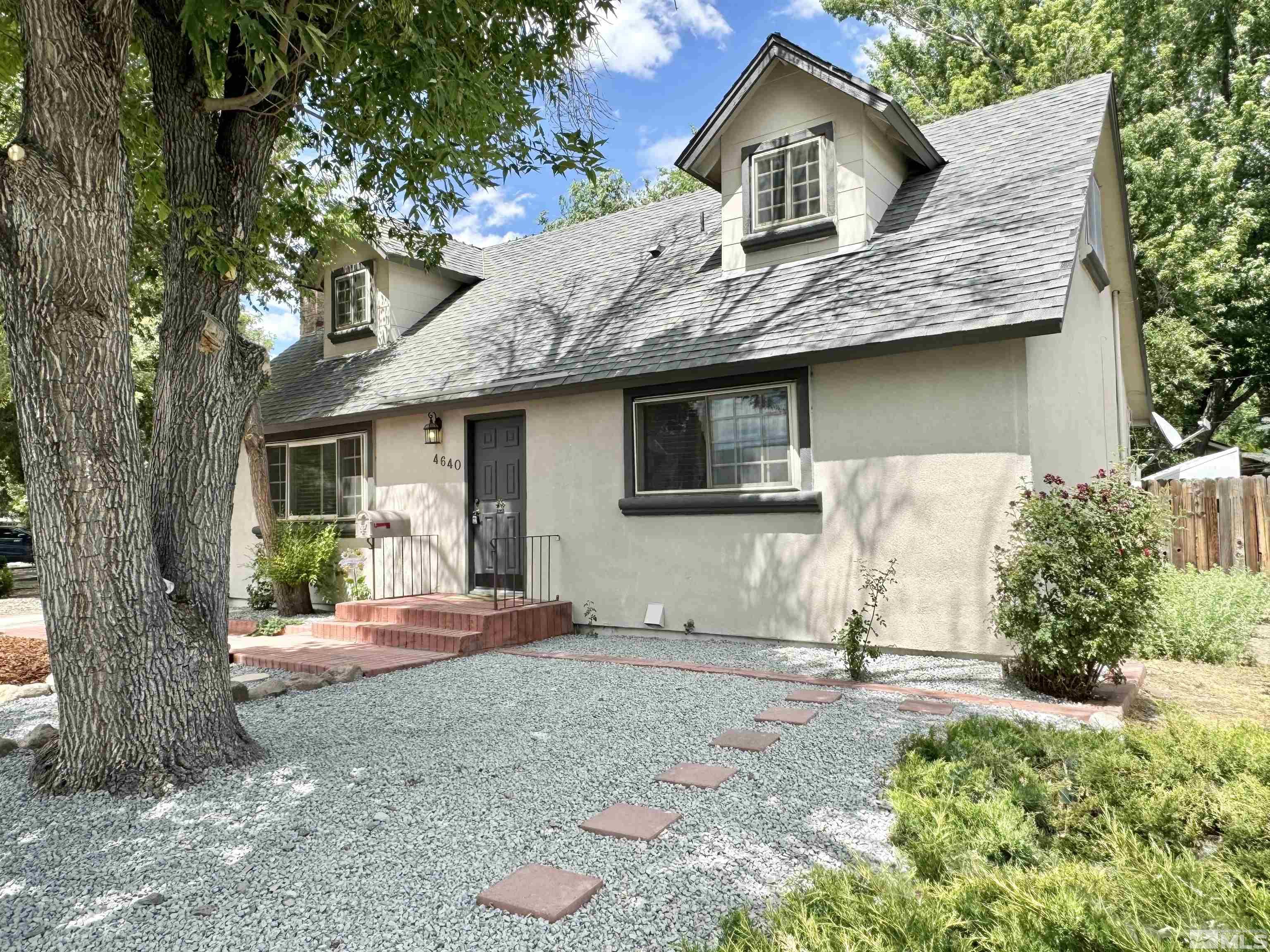 4640 Aster Drive Reno, NV 89502 - Photo 2 of 22 a front view of a house with a yard