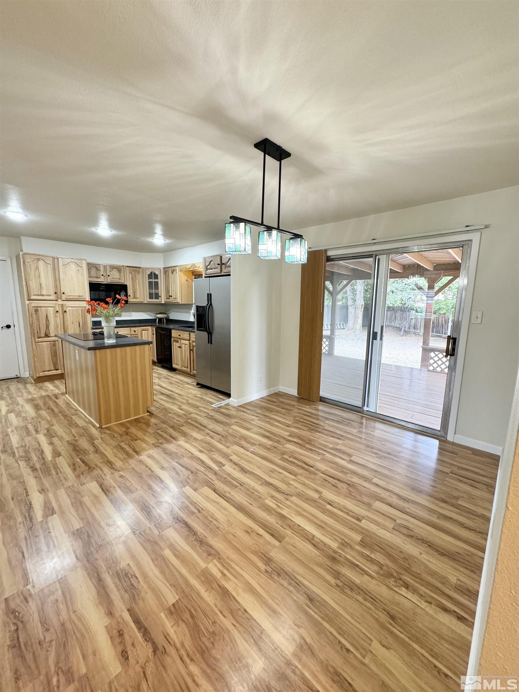 4640 Aster Drive Reno, NV 89502 - Photo 5 of 22 a view of a kitchen with a refrigerator and a window