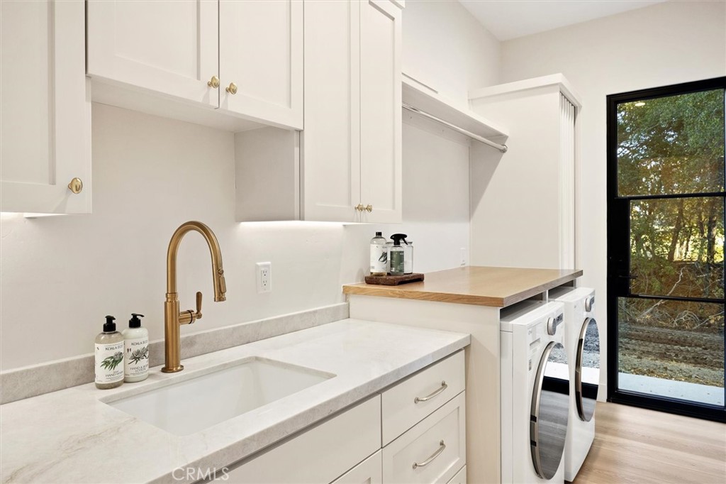 5260 Windmill Way San Luis Obispo, CA 93401 - Photo 14 of 35 a view of a kitchen with sink and washing machine