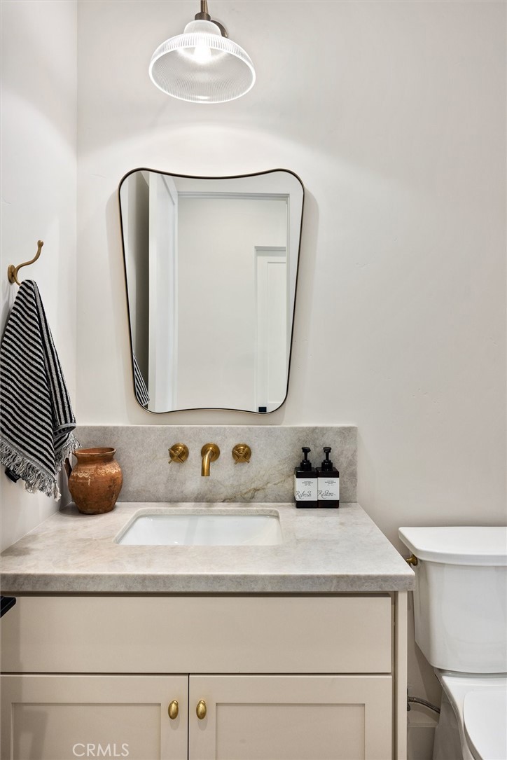 5260 Windmill Way San Luis Obispo, CA 93401 - Photo 20 of 35 a bathroom with a sink and a mirror