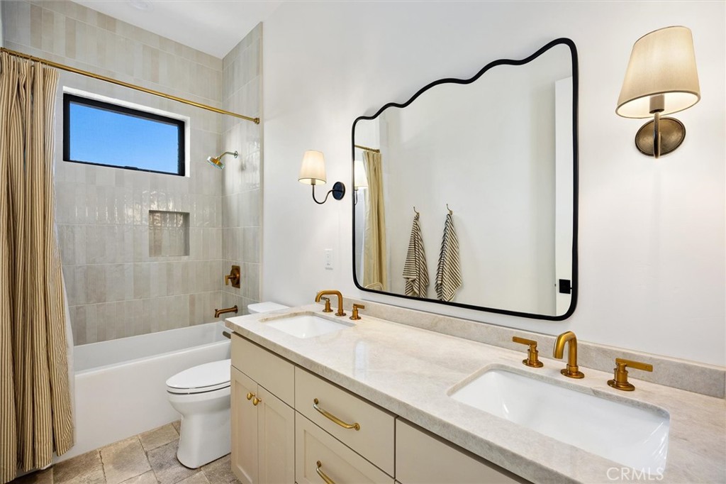 5260 Windmill Way San Luis Obispo, CA 93401 - Photo 21 of 35 a bathroom with a double vanity sink and a mirror