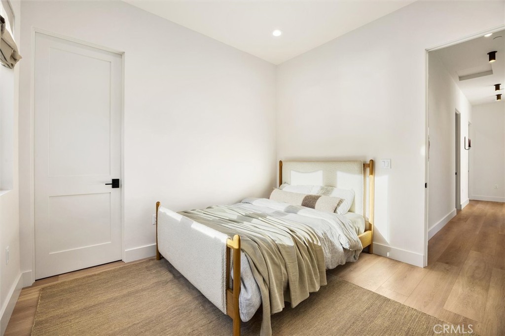 5260 Windmill Way San Luis Obispo, CA 93401 - Photo 23 of 35 a bedroom with a bed and a night stand