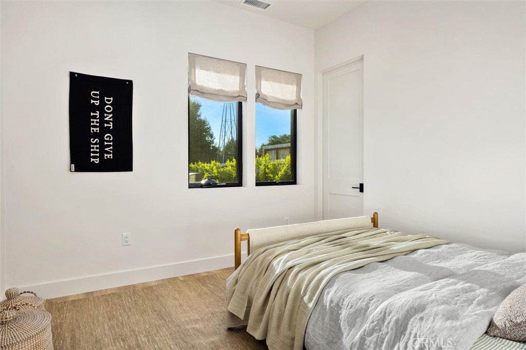 5260 Windmill Way San Luis Obispo, CA 93401 - Photo 24 of 35 a bedroom with a bed and a window