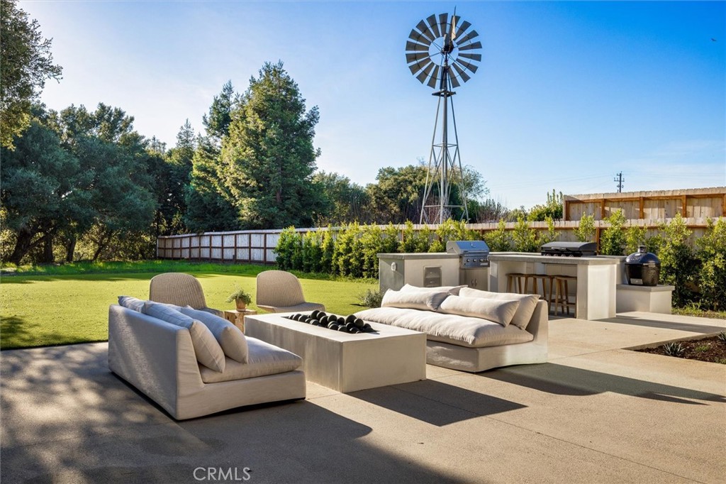 5260 Windmill Way San Luis Obispo, CA 93401 - Photo 30 of 35 a view of a patio with couches potted plants and a big yard