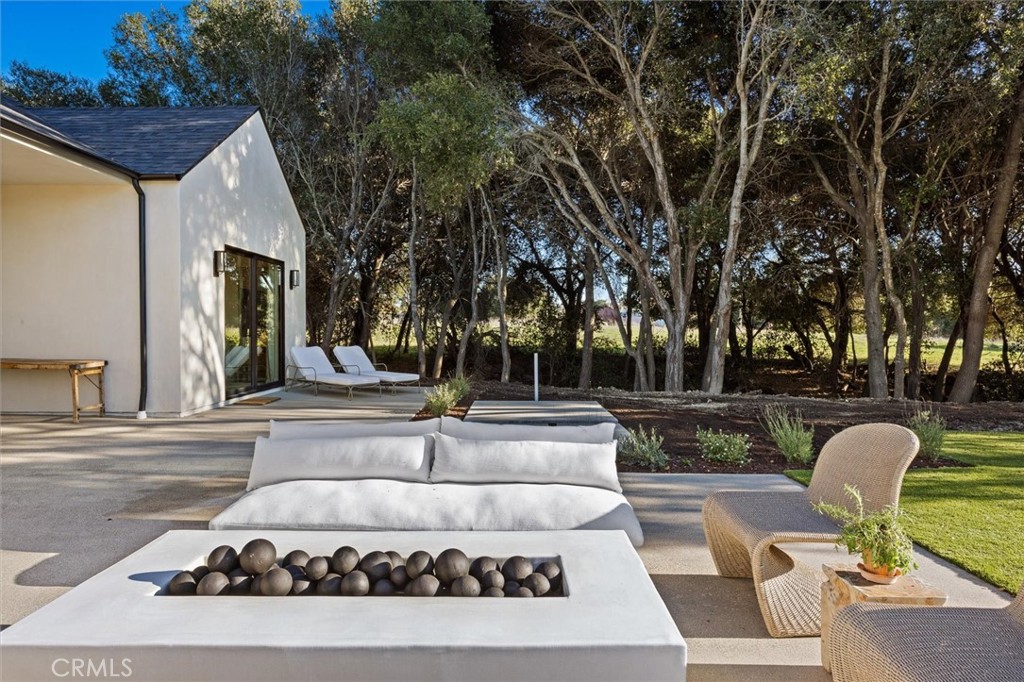 5260 Windmill Way San Luis Obispo, CA 93401 - Photo 31 of 35 a view of a house with a couches and dinning table and chairs in a patio