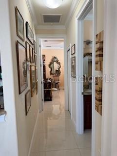3013 West Leroy Street Tampa, FL 33607 - Photo 18 of 22 a view of a hallway with living room and furniture