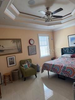 3013 West Leroy Street Tampa, FL 33607 - Photo 8 of 22 a bedroom with a bed and a chandelier