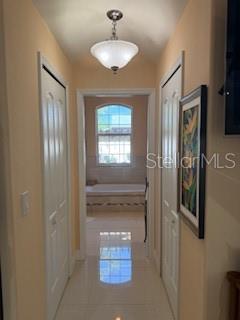 3013 West Leroy Street Tampa, FL 33607 - Photo 10 of 22 a bathroom with a granite countertop sink a mirror and shower