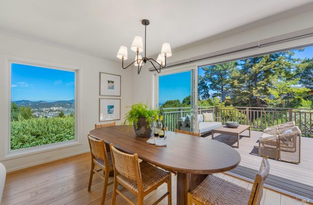a view of a dining room with furniture window and wooden floor