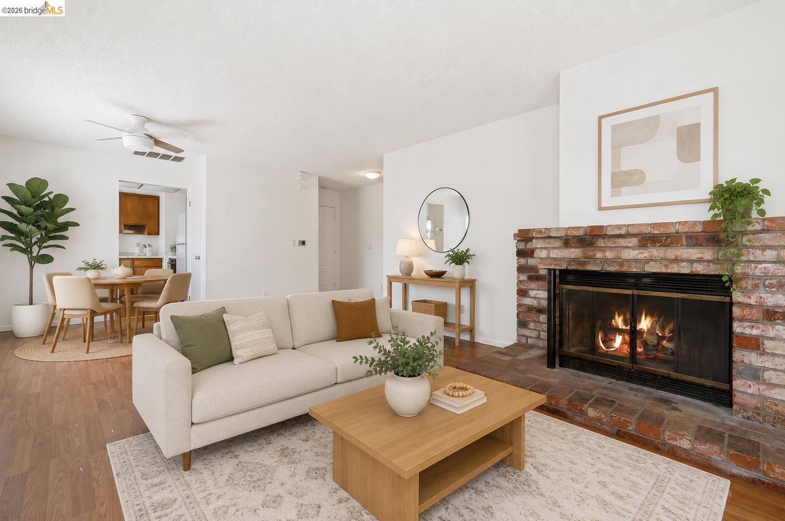 1151 Chadwick Circle Bay Point, CA 94565 - Photo 1 of 23 Living area featuring a brick fireplace with a black fire screen