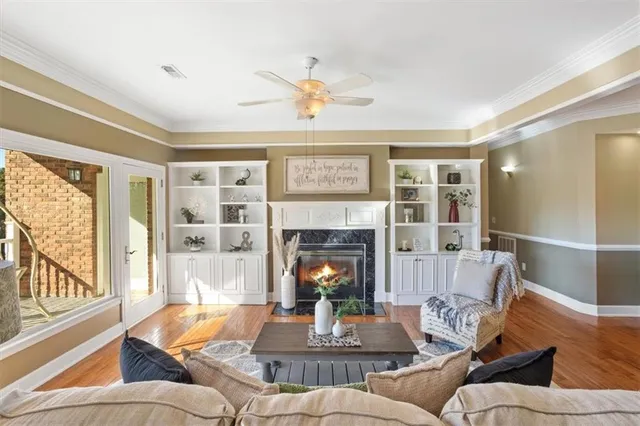 a view of a dining room with furniture wooden floor and chandelier