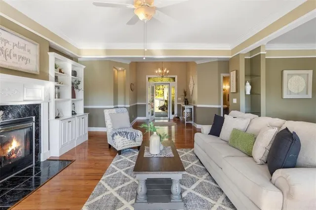 a view of a dining room with furniture wooden floor and chandelier