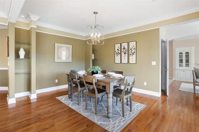 a kitchen with stainless steel appliances granite countertop a sink a stove and a microwave