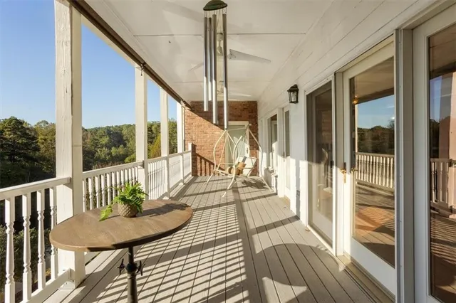 a kitchen with kitchen island granite countertop a sink a counter top space and cabinets