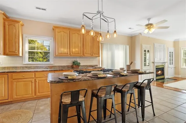 a view of empty room with wooden floor and fireplace