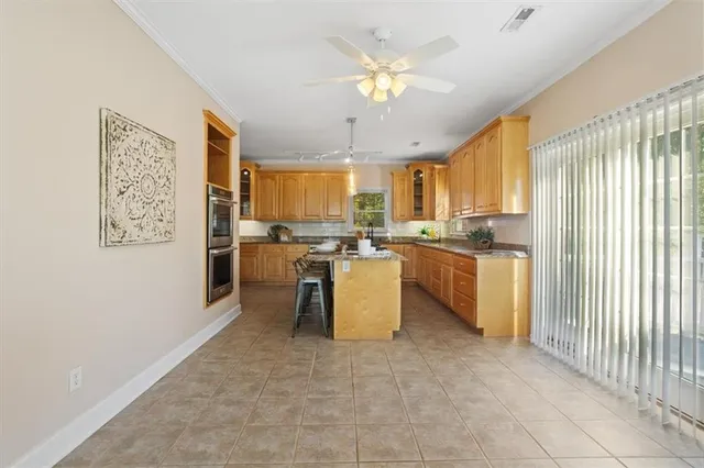 a white bath tub sitting in a bathroom next to a window