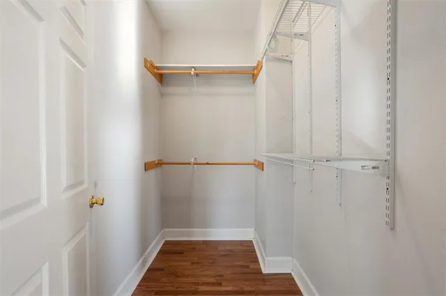 an aerial view of residential house with outdoor space and trees all around